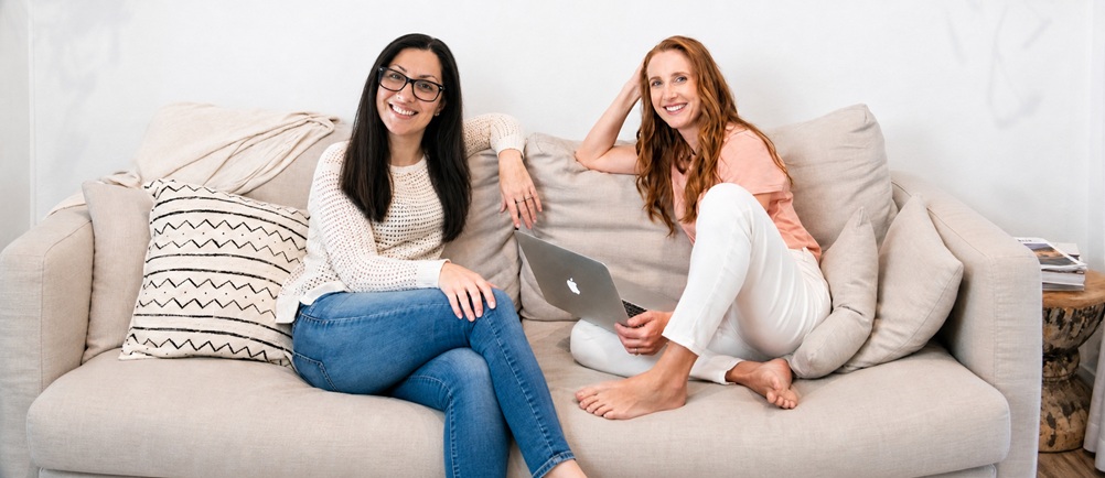 Jo And Caroline Sitting On A Couch